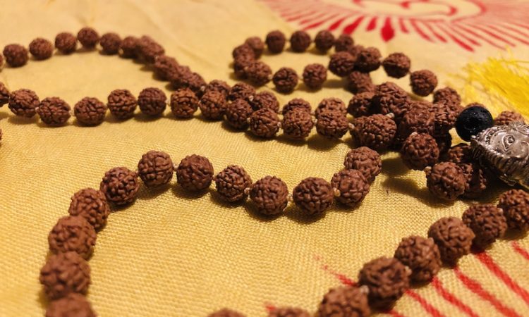 Traditional Mala placed on Indian scarf